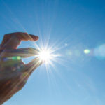 Sun between fingers