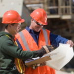 Two engineers planning at a gravel and asphalt plant